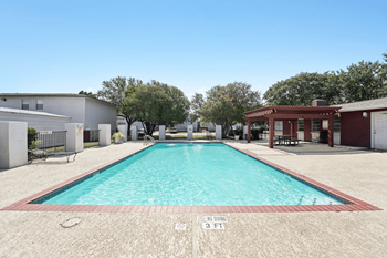 A rectangular pool with a red border and a sign that says "POOL AND DRILLING 3 PM".